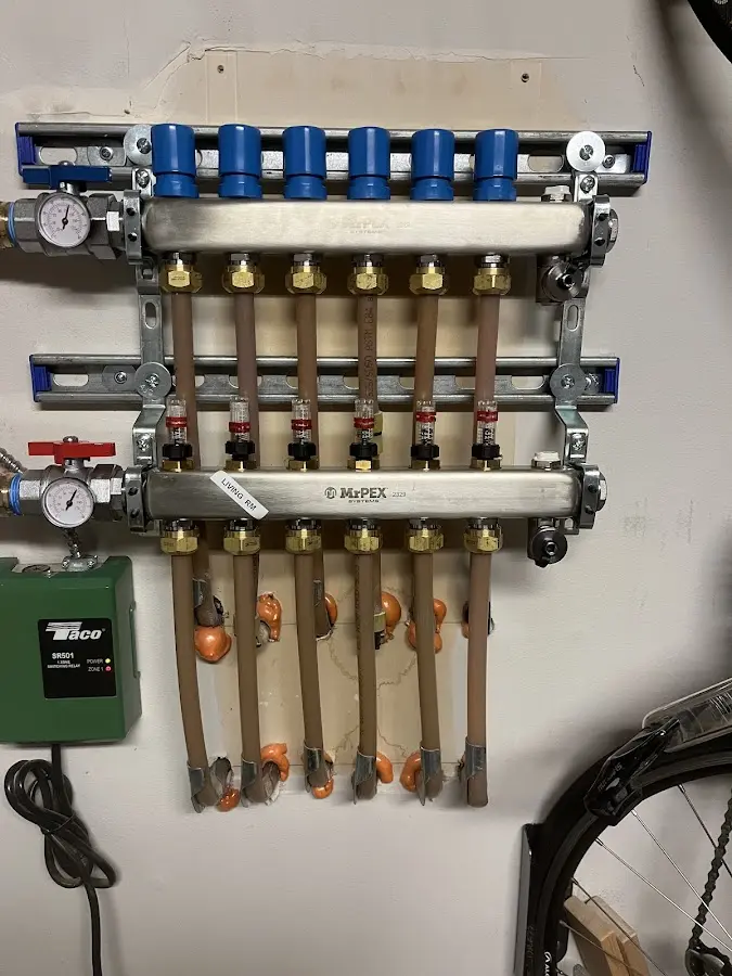 Plumber performing Water Heater Repair at a residential property in Hoosick Falls